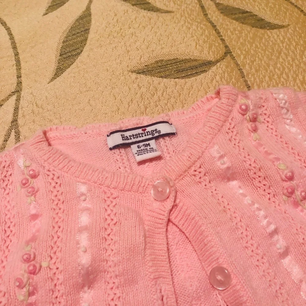 Pink button down sweater from Hartstrings
